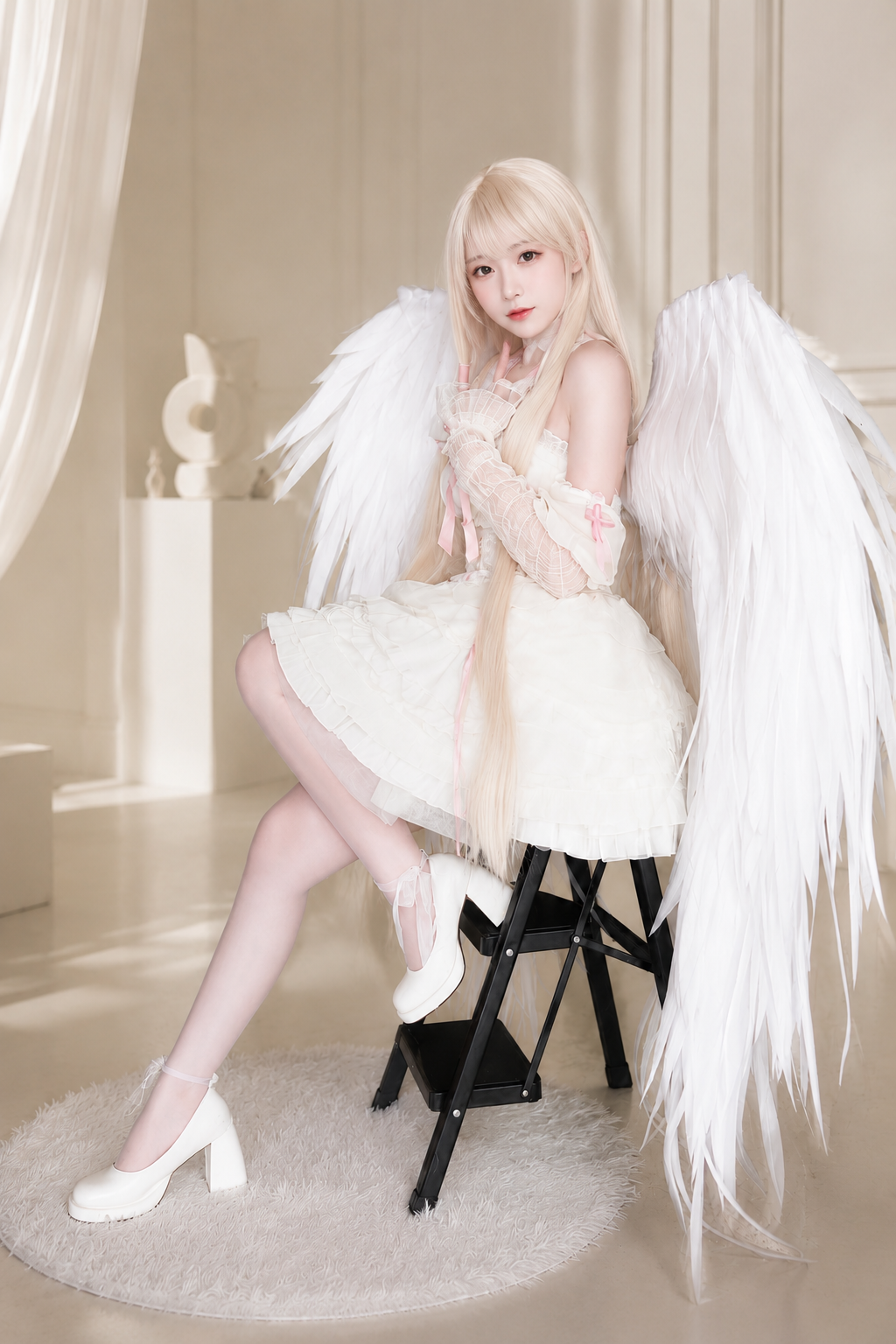 Client photo of a custom detachable foldable white angel wing cosplay prop worn with a soft fantasy costume.