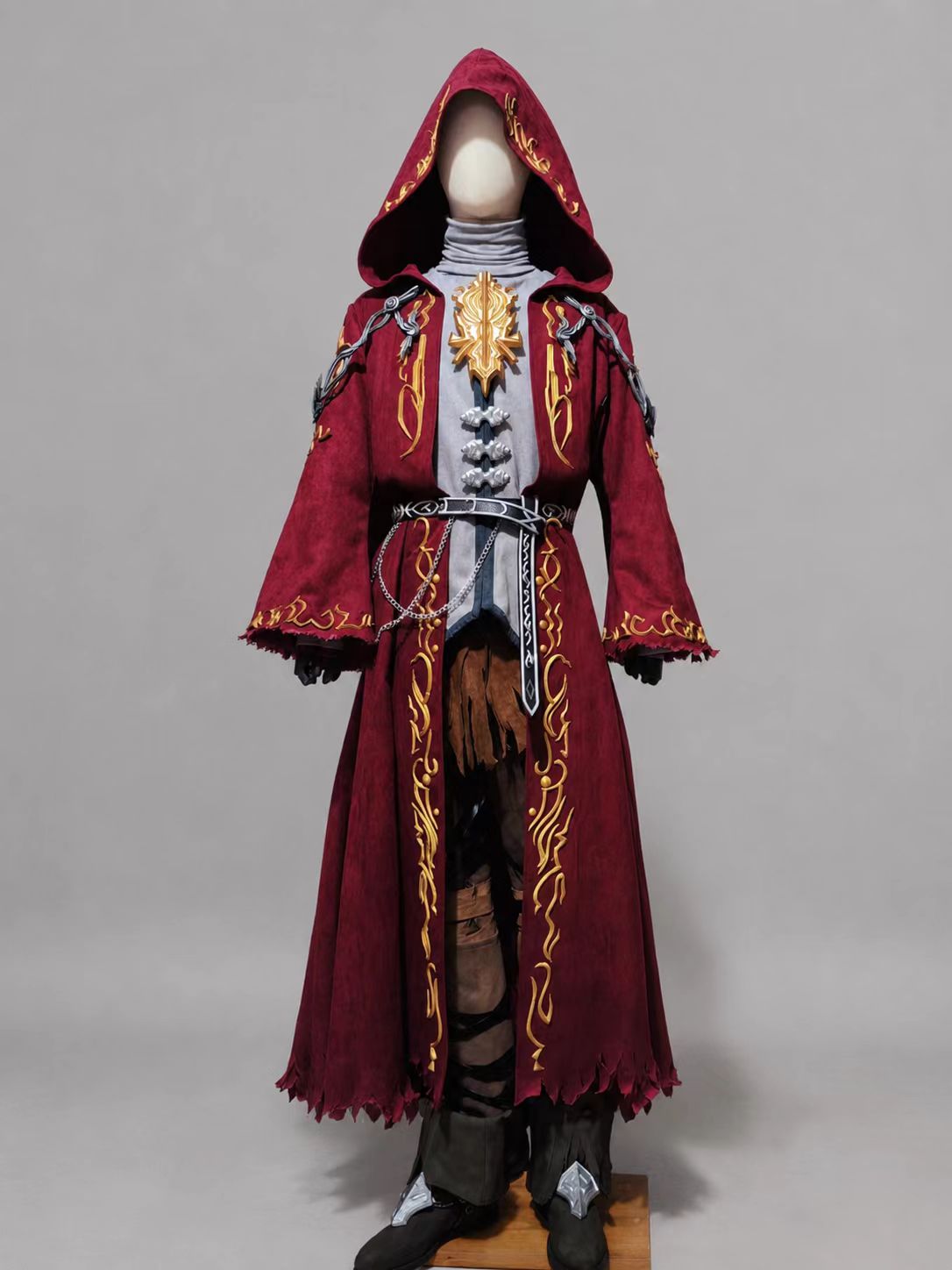Fandaniel Final Fantasy XIV cosplay costume with dark red hooded coat, gold trim, high-neck inner top, vest, pants, leg wraps, shoes, and body accessories.