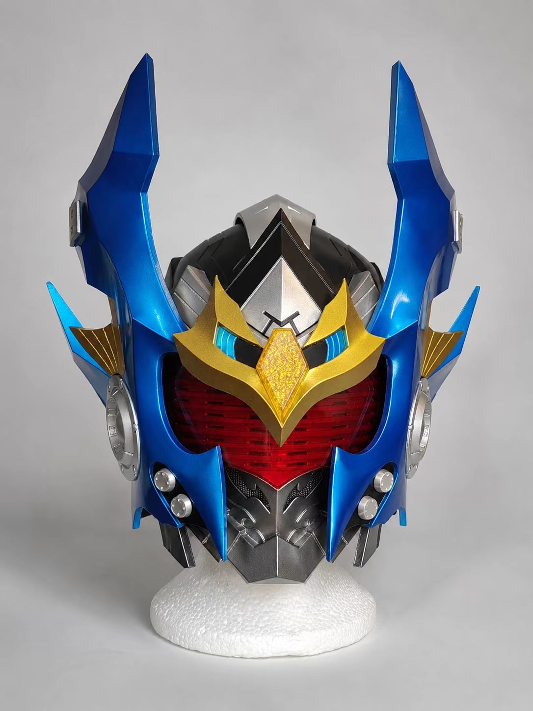 Finished blue and gold custom cosplay helmet side view.