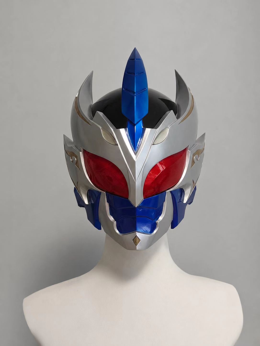 Front view of a blue white and red custom cosplay helmet.