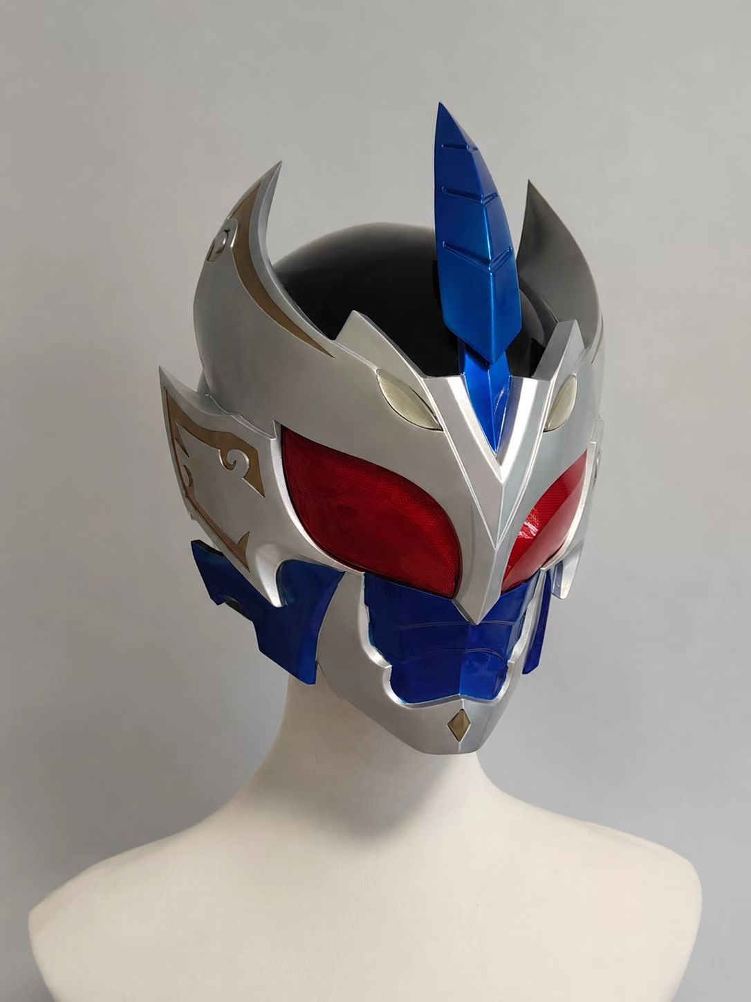 Blue white and red custom cosplay helmet shown on a wearer.