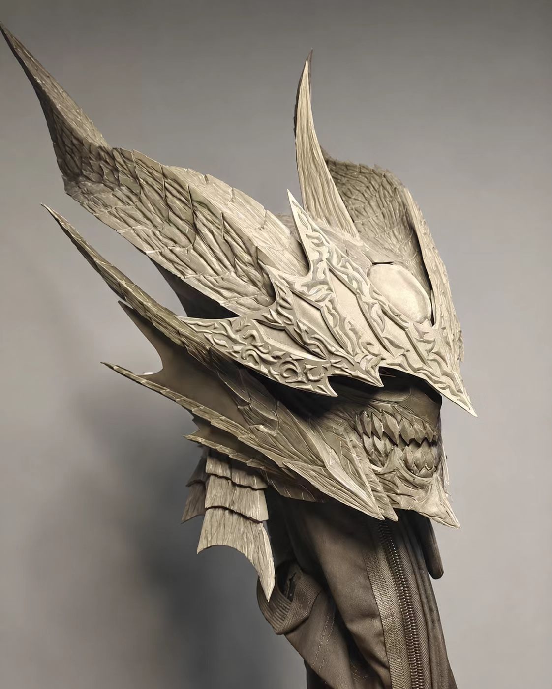 Black dragon-style custom cosplay helmet detail view.