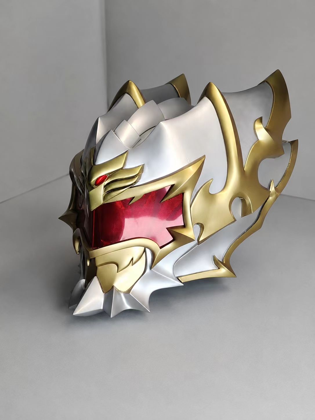 Close-up of a gold custom cosplay helmet cheek contour.