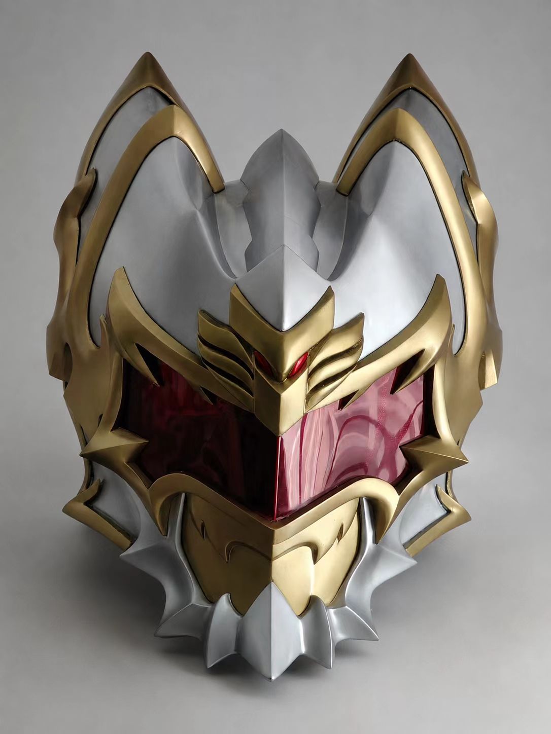 Ornate gold and red custom cosplay helmet front view.