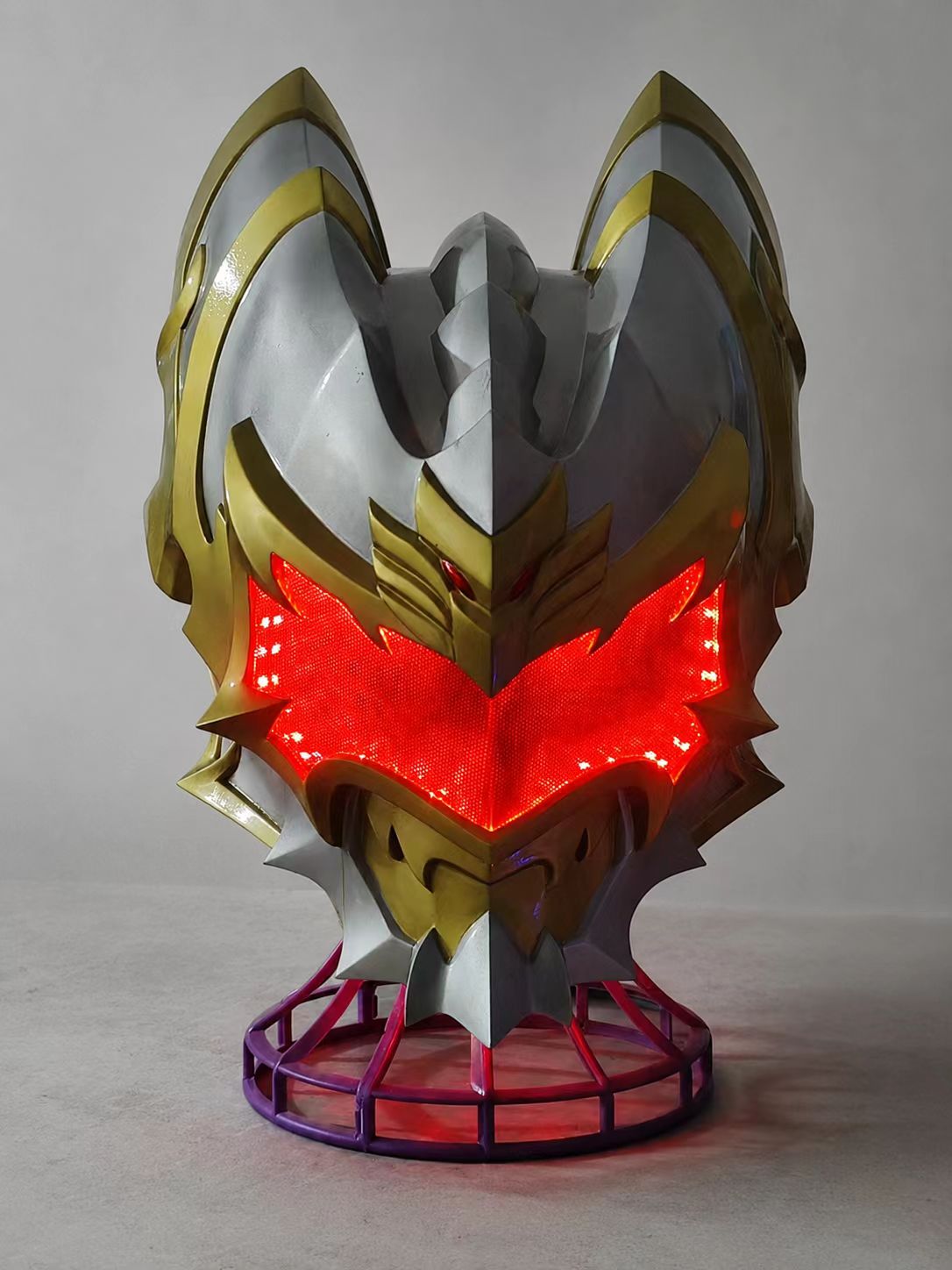 Silver and red custom cosplay helmet with mouthguard detail.