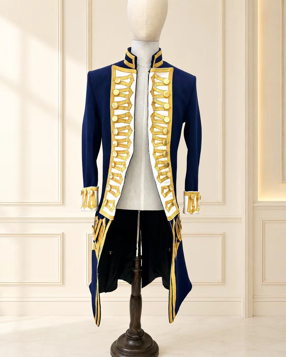 Late 18th century British Royal Navy officer uniform with navy coat, ivory panels, high-grade gold metallic braid, structured collar, and cuff details.