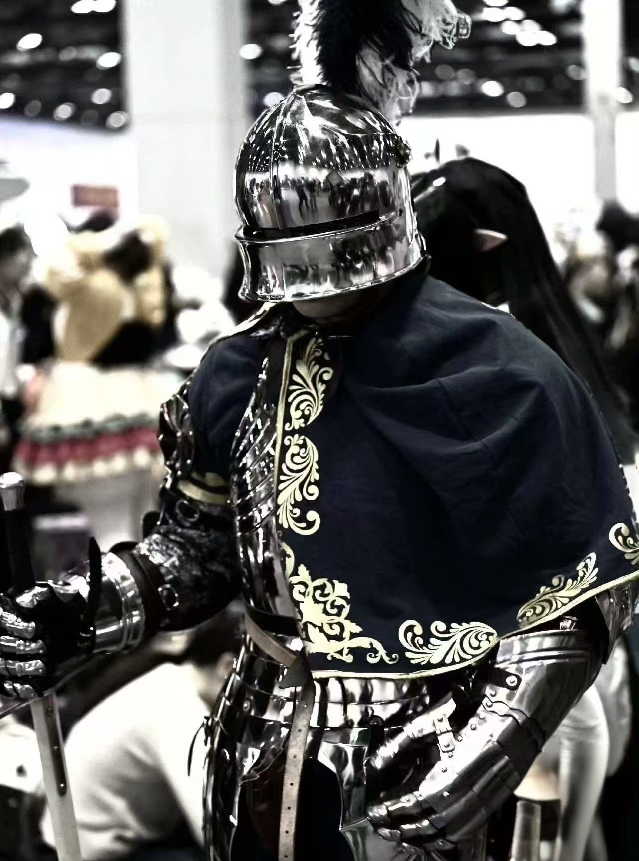 Black medieval armor styling reference with dark cloak and helmet.