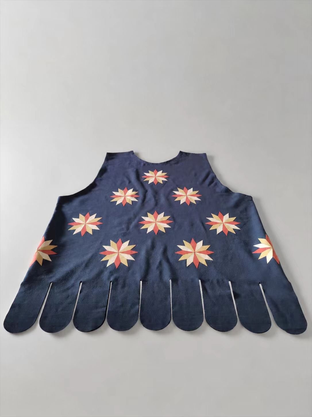 Blue medieval cosplay glove pair with small floral motifs.