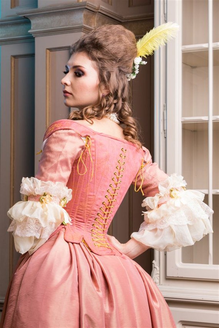 A rose rococo costume base with lace-up bodice, sleeve trim, and silhouette details suited to reference-led custom planning.