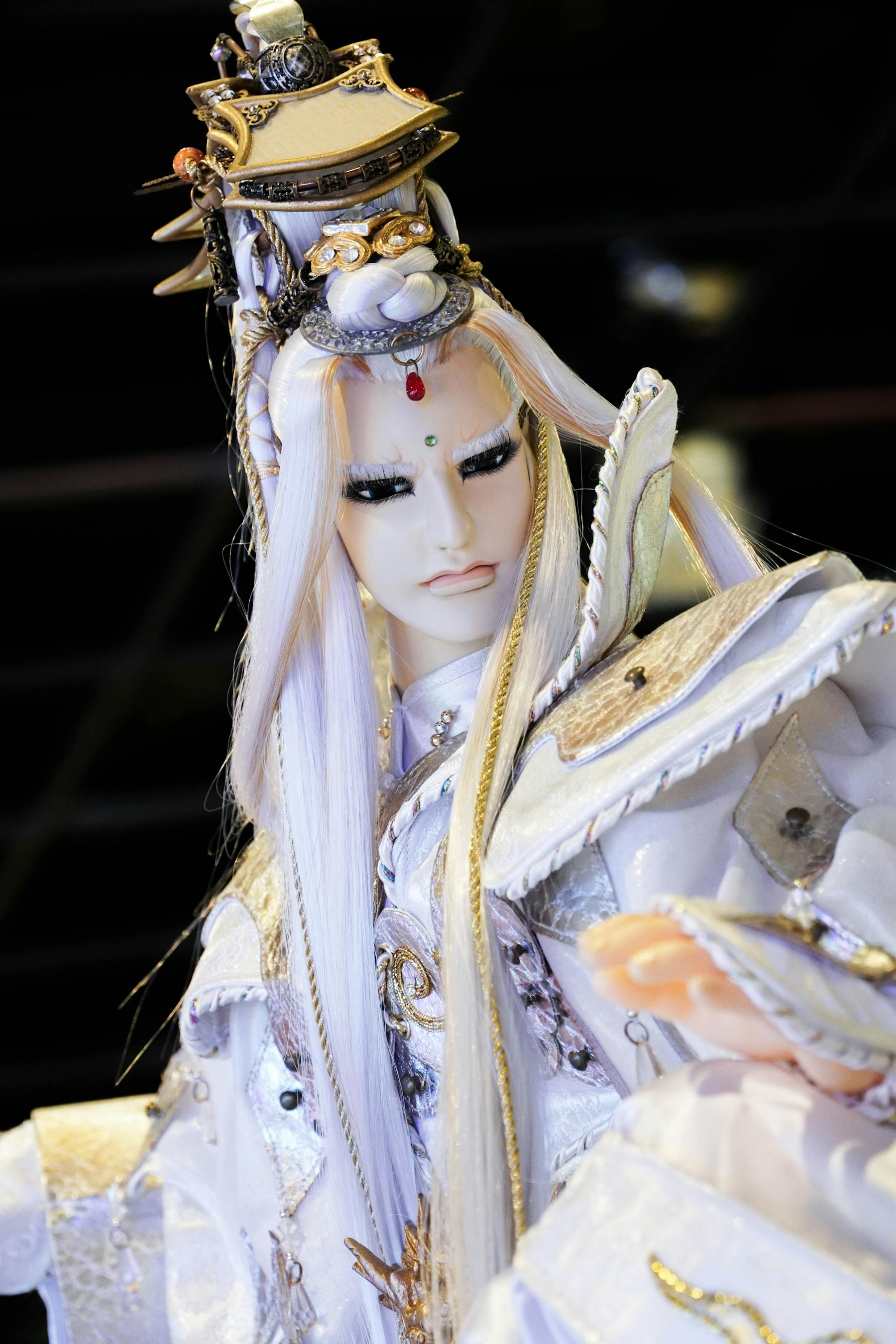 A large fantasy armor costume with sculpted surfaces, helmet form, and convention-scale presence.