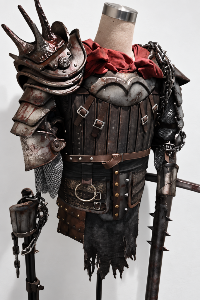 Front view of Dead by Daylight The Knight weathered cosplay armor, red scarf and prop weapons